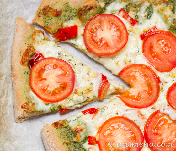 Pesto Pizza with roasted red pepper, tomato and roasted corn